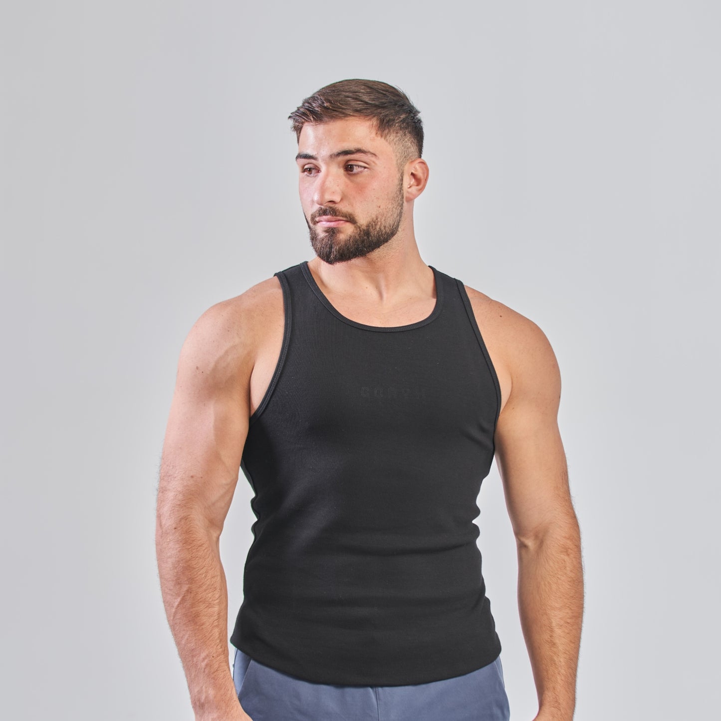 CORYX Tank gymwear highlighting stylish streetwear for fitness enthusiasts and urban fashion lovers