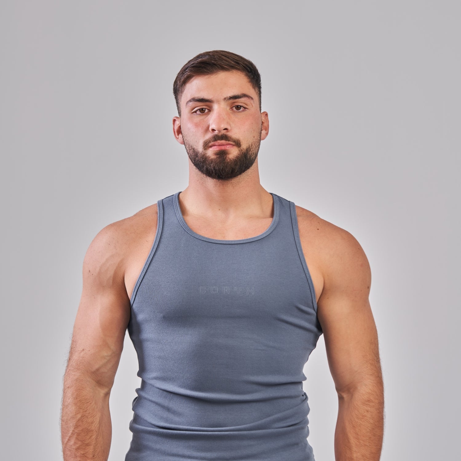 CORYX Tank gymwear highlighting stylish streetwear for fitness enthusiasts and urban fashion lovers
